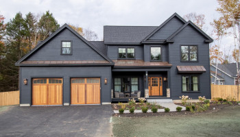 Dark siding installed on a home by Craftsman Exterior Remodeling